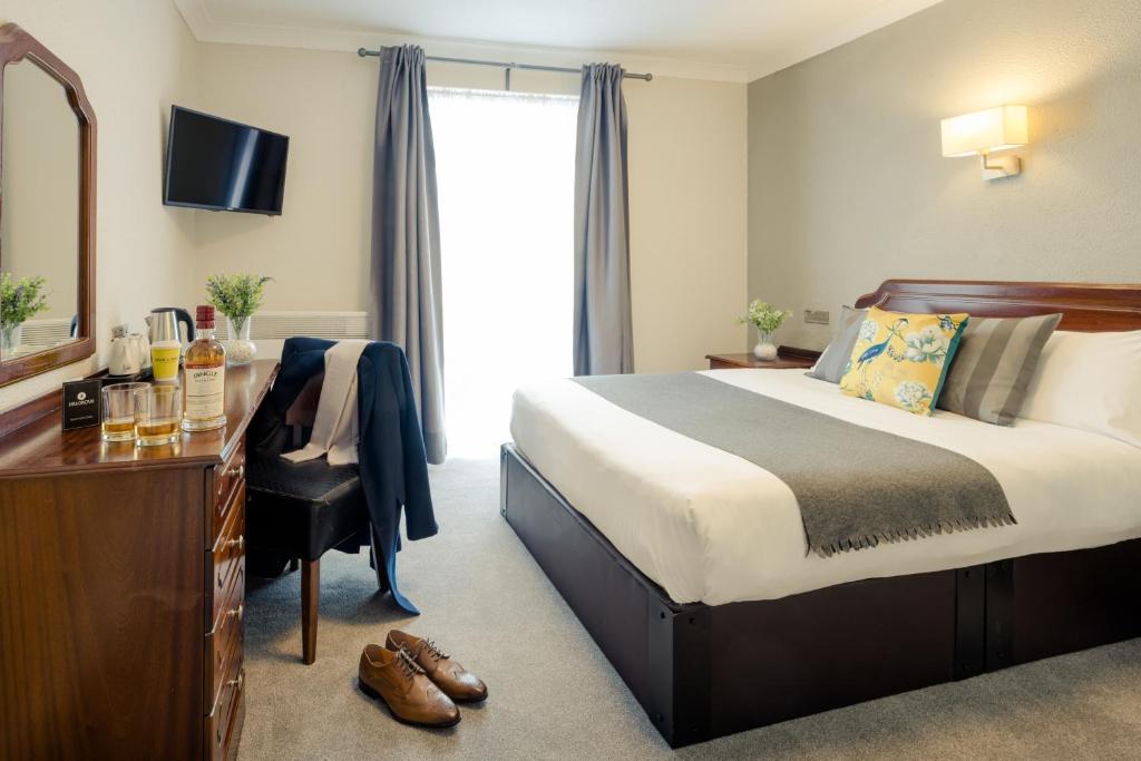 Postel nebo postele na pokoji v ubytování Hillgrove Guesthouse