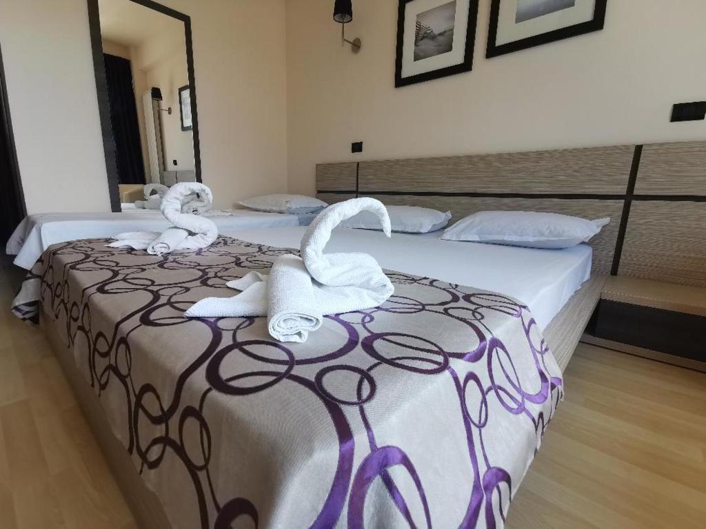 Postel nebo postele na pokoji v ubytování Vila Sangria