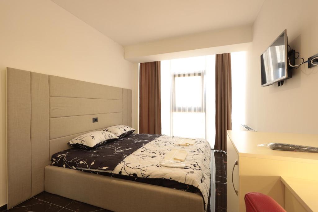 Postel nebo postele na pokoji v ubytování HOTEL EMA