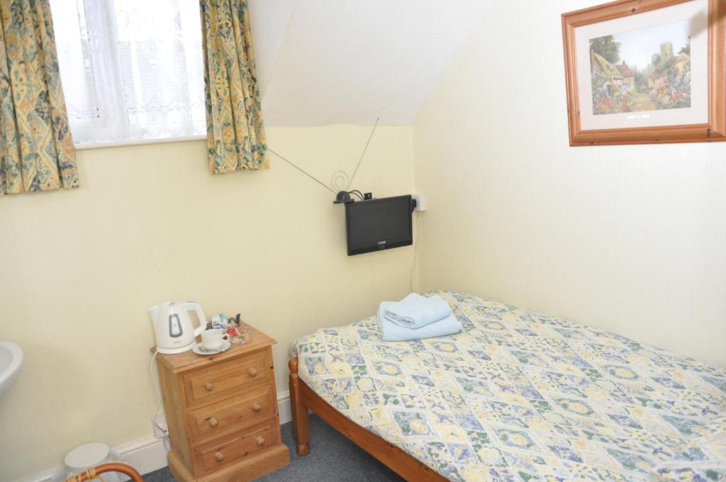 Postel nebo postele na pokoji v ubytování Chandos Premier Folkestone (Channel Tunnel) Hotel