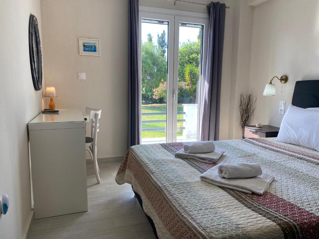 Postel nebo postele na pokoji v ubytování Alexander Apartments
