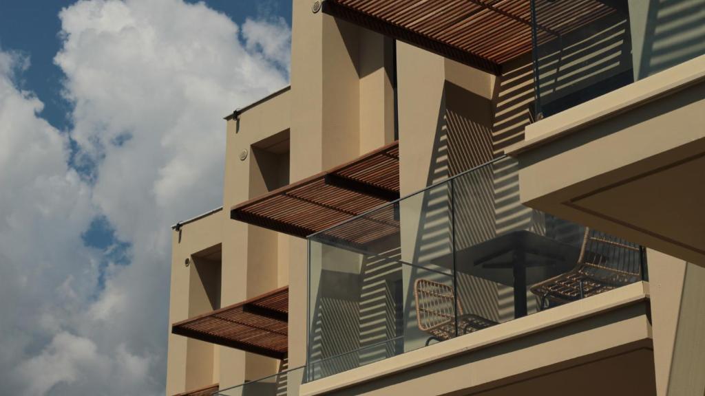 a building with balconies on the side of it at KYVO Experience in Skala Potamias