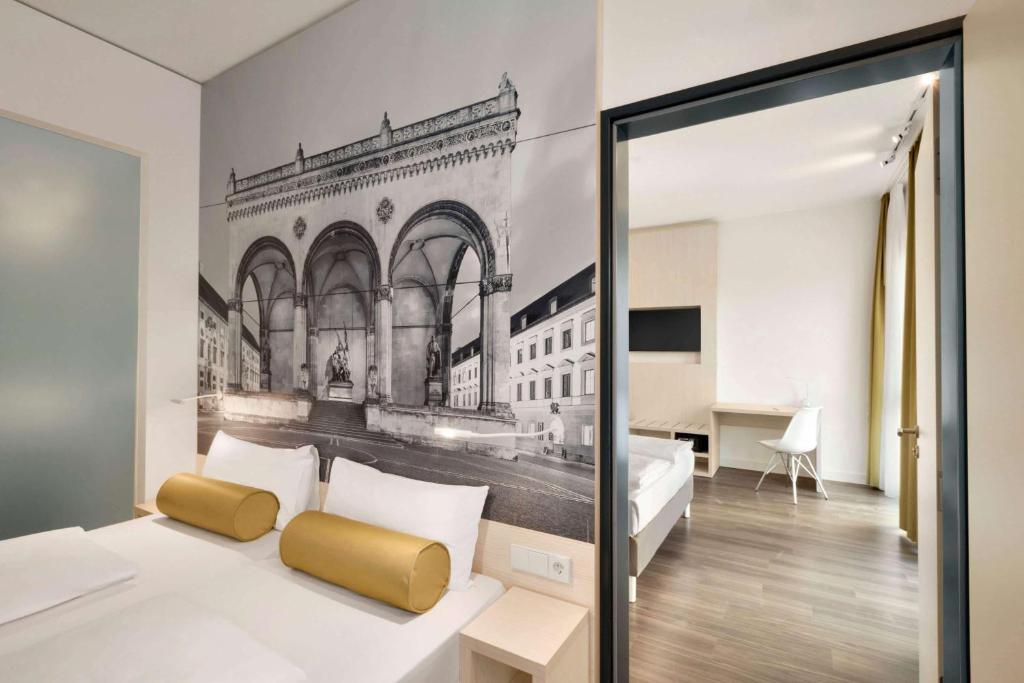 a bedroom with a bed with a mural of a building at Super 8 by Wyndham Munich City North in Munich