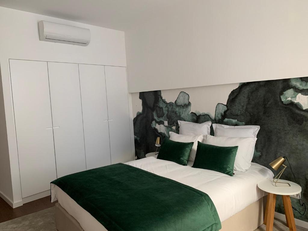 Postel nebo postele na pokoji v ubytování Pharmacia GuestHouse