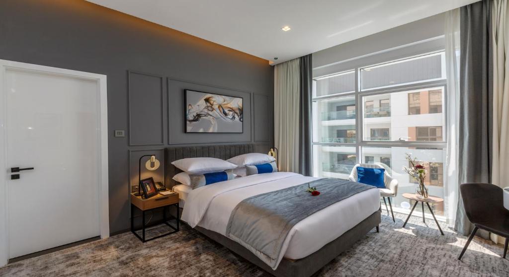 Postel nebo postele na pokoji v ubytování Rose Executive Hotel - DWTC