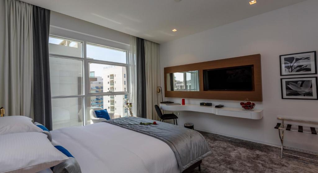 Postel nebo postele na pokoji v ubytování Rose Executive Hotel - DWTC