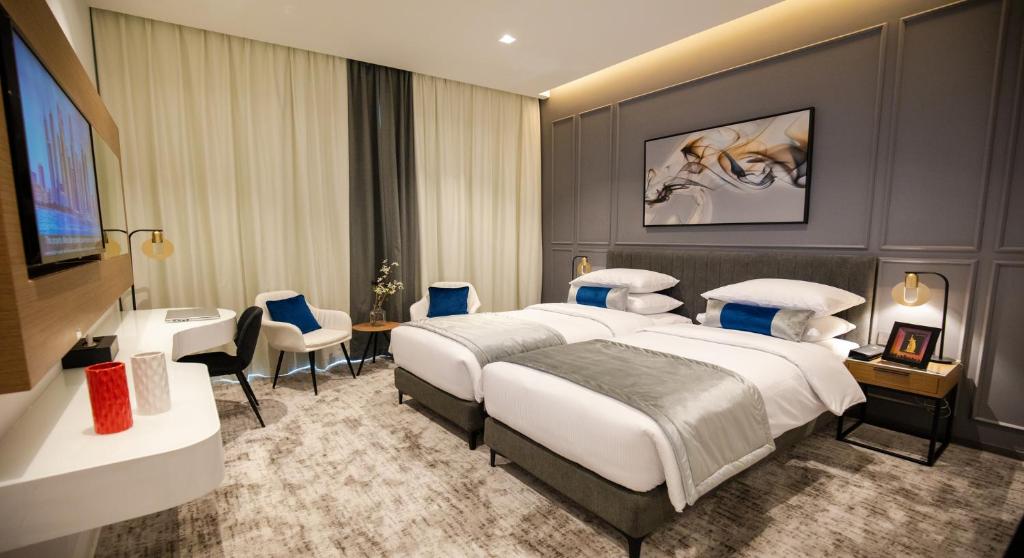 Postel nebo postele na pokoji v ubytování Rose Executive Hotel - DWTC