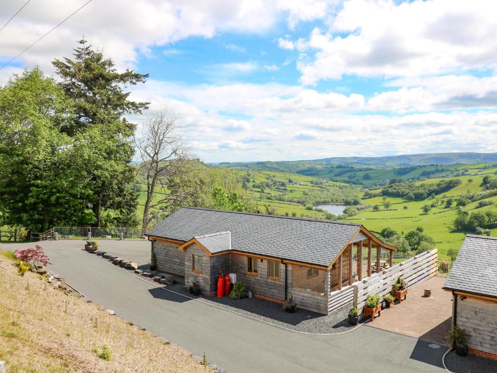 an overhead view of a home with a view of the valley at The Larches in Llanidloes