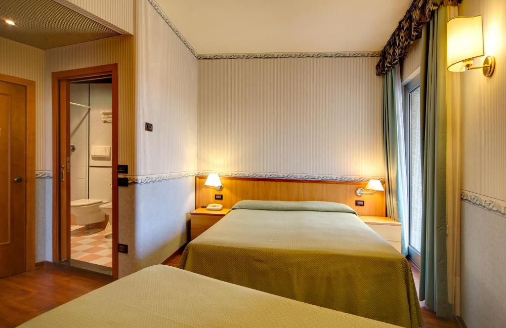 Кровать или кровати в номере Hotel Palace