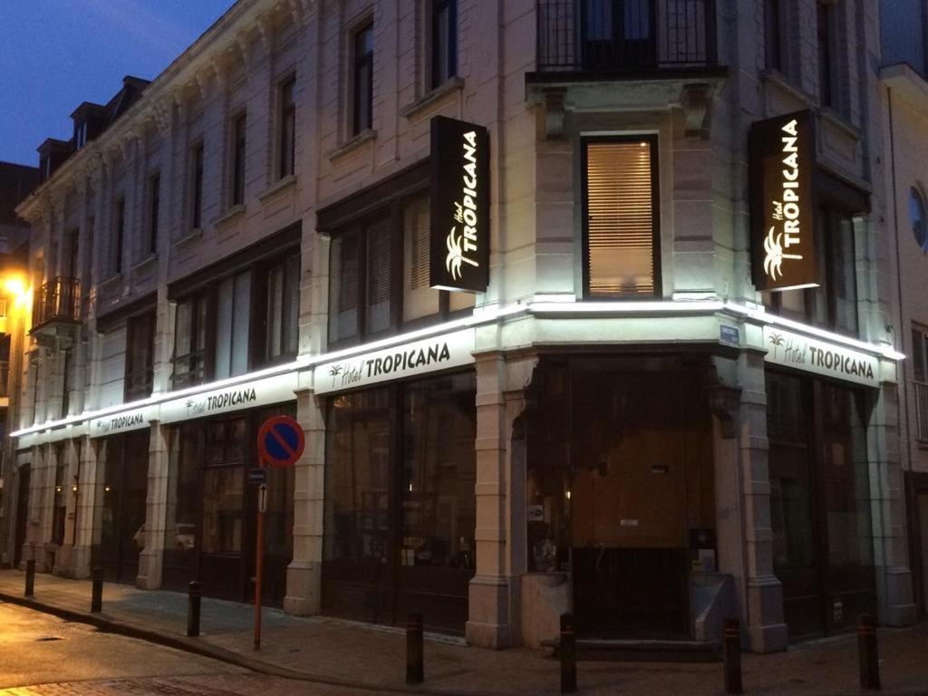 a building on a city street at night at Hotel Tropicana in Blankenberge