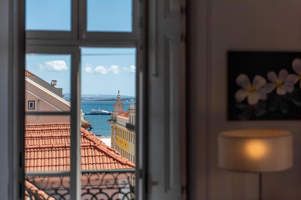 a view of the water from a window at LV Premier Apartments Baixa- CN in Lisbon