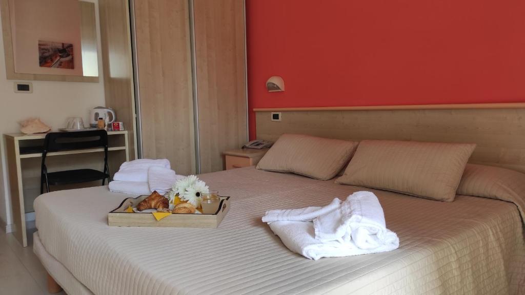 Postel nebo postele na pokoji v ubytování Hotel Eliani