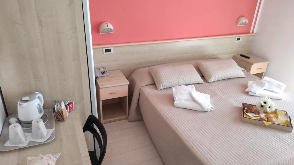 Postel nebo postele na pokoji v ubytování Hotel Eliani