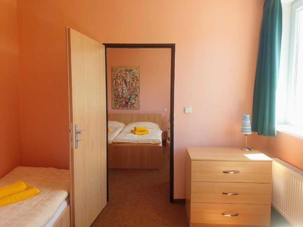 Postel nebo postele na pokoji v ubytování Penzion Lumis