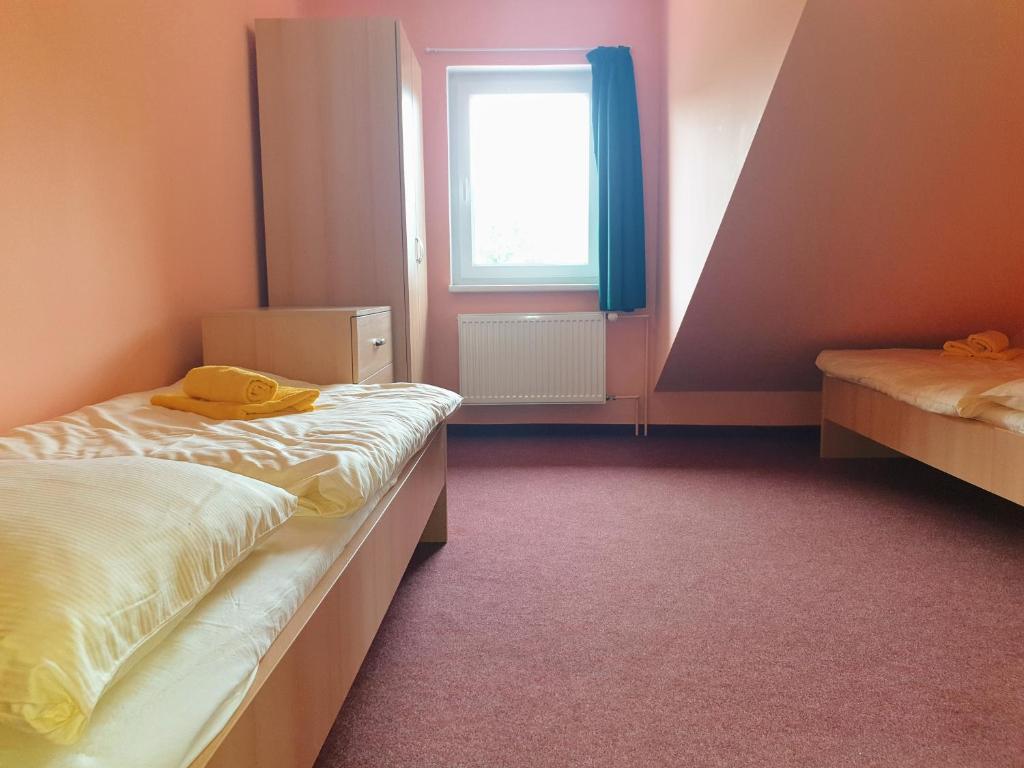 Postel nebo postele na pokoji v ubytování Penzion Lumis