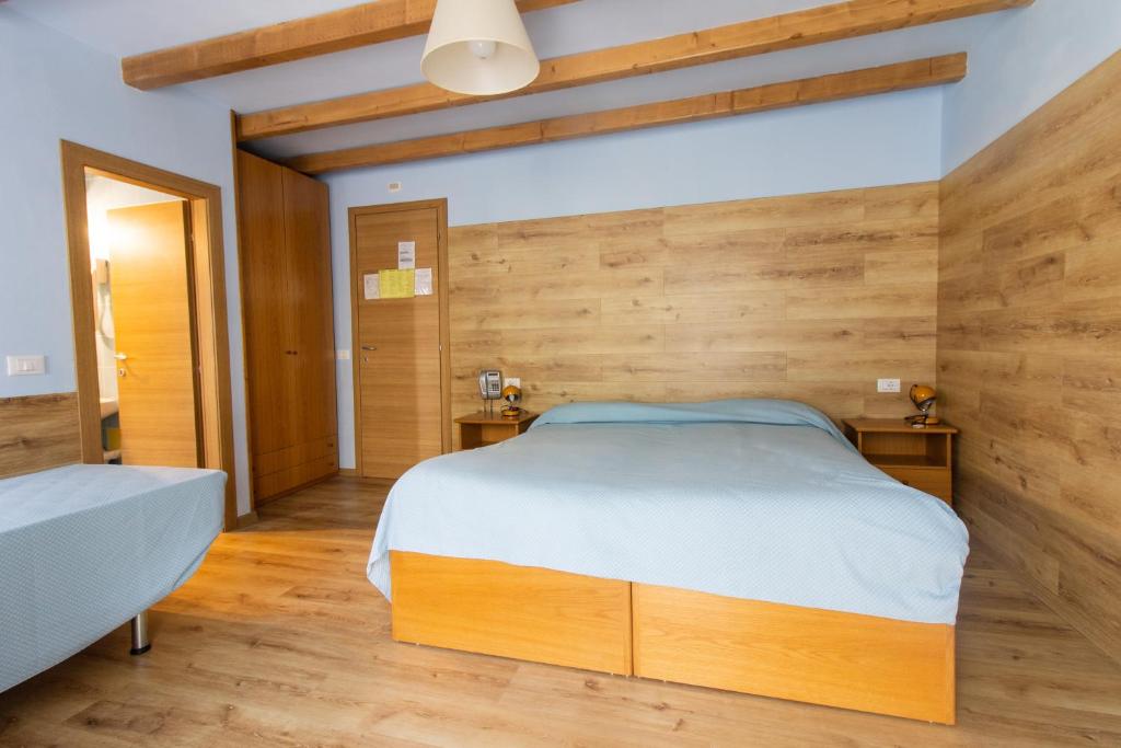 Postel nebo postele na pokoji v ubytování Albergo Speranza
