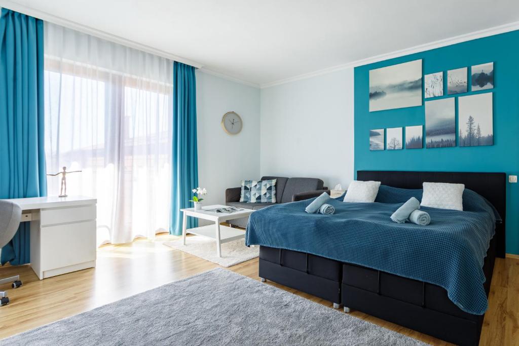 Posteľ alebo postele v izbe v ubytovaní Villa Muzsa Deluxe