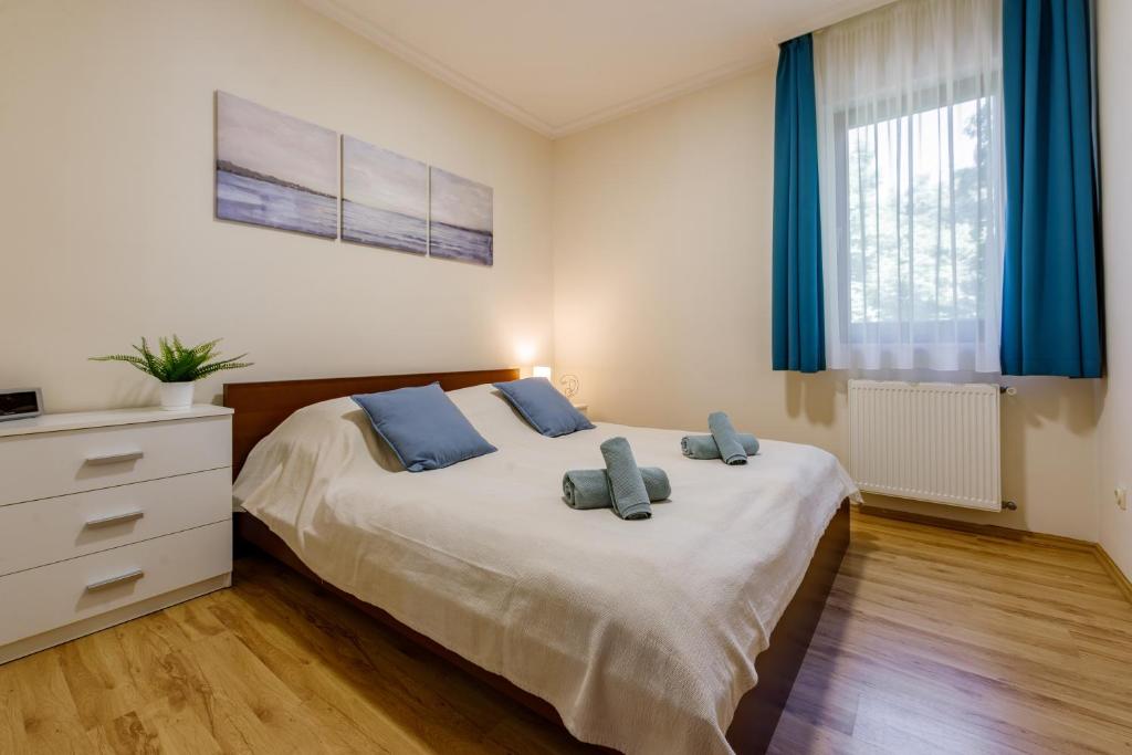 Posteľ alebo postele v izbe v ubytovaní Villa Muzsa Deluxe