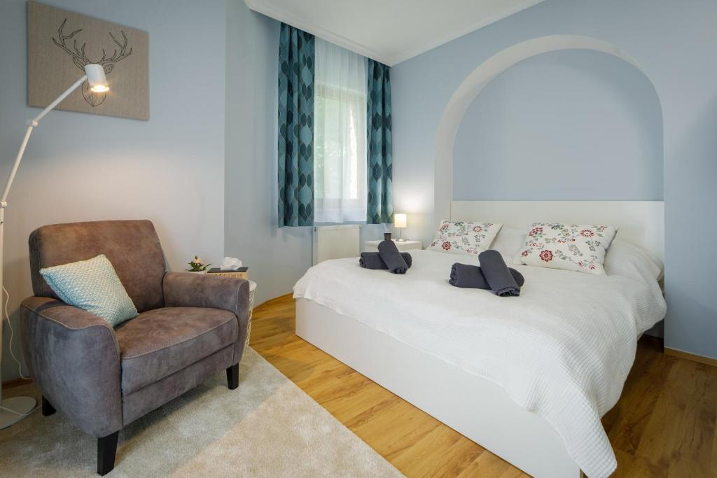 Posteľ alebo postele v izbe v ubytovaní Villa Muzsa Deluxe