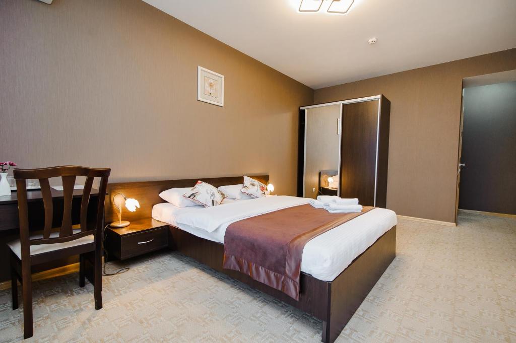 Postel nebo postele na pokoji v ubytování TipTop Hotel CITY CENTER