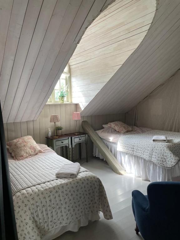 Postel nebo postele na pokoji v ubytování Arphus Lodge
