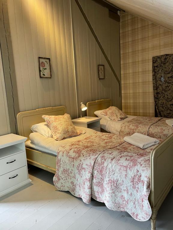 Postel nebo postele na pokoji v ubytování Arphus Lodge