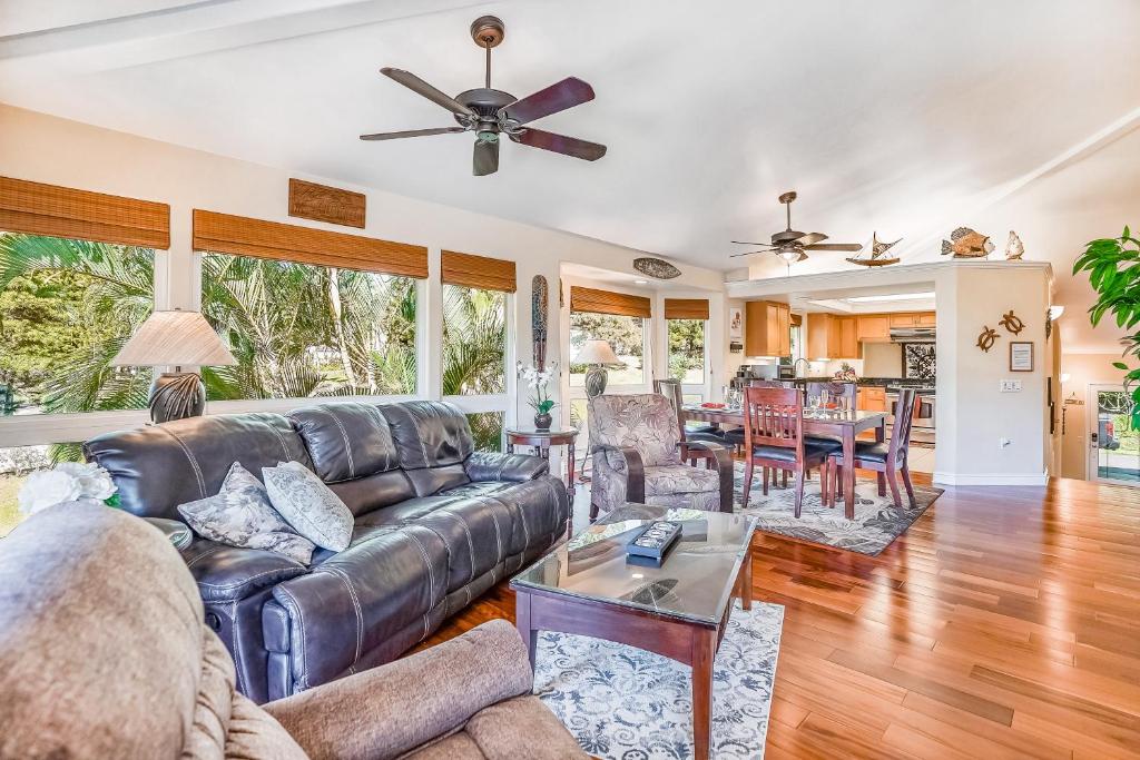 a living room with a couch and a table at Villas of Kamali'i in Princeville