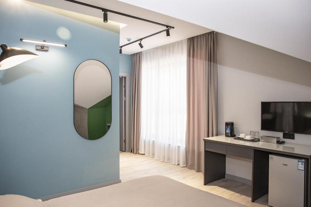 TV a/nebo společenská místnost v ubytování Maison