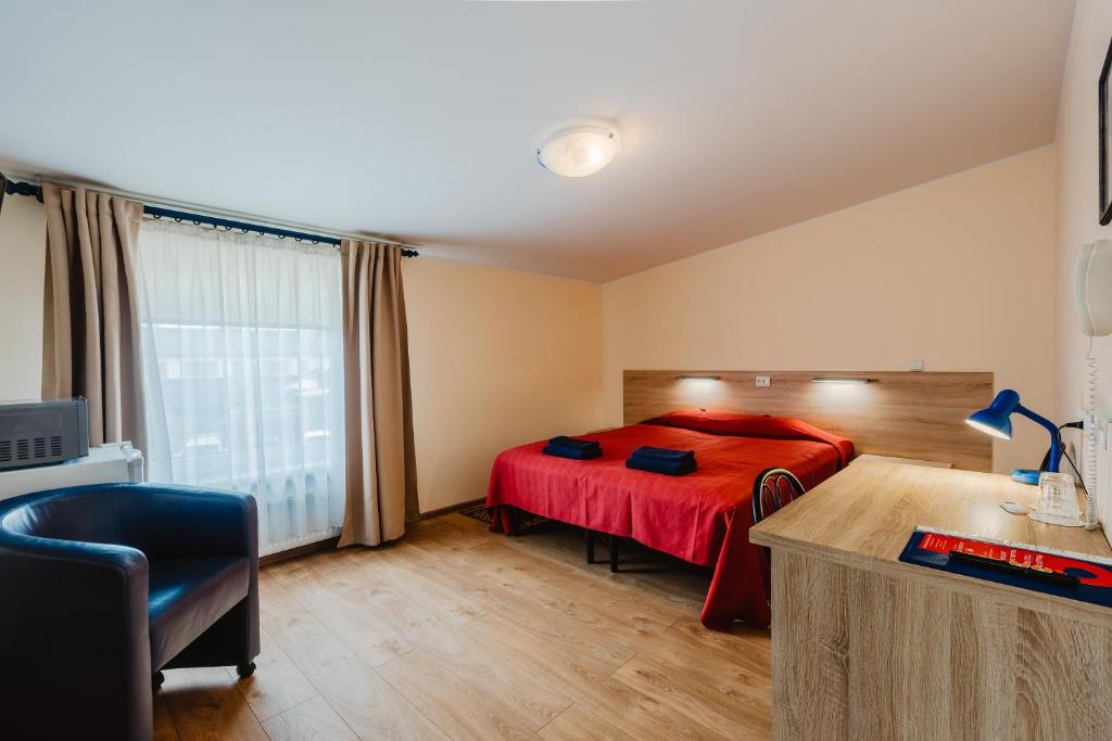 Postel nebo postele na pokoji v ubytování Aleksandri Hotel