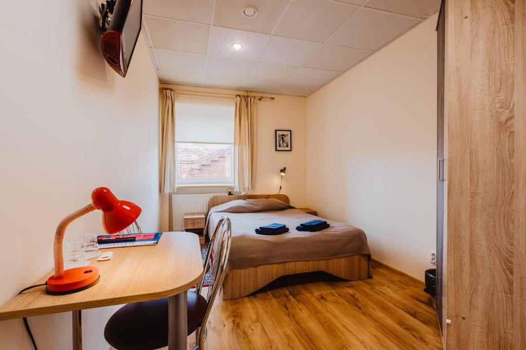 Postel nebo postele na pokoji v ubytování Aleksandri Hotel