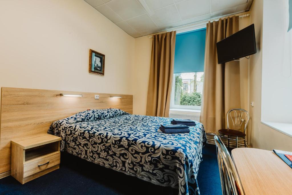 Postel nebo postele na pokoji v ubytování Aleksandri Hotel