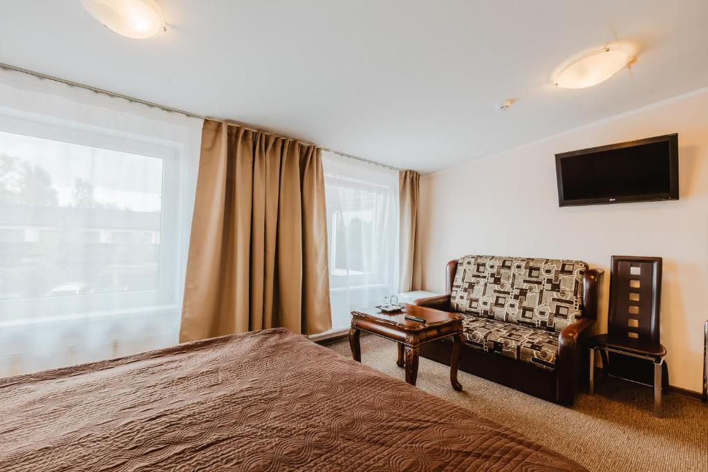 TV a/nebo společenská místnost v ubytování Aleksandri Hotel