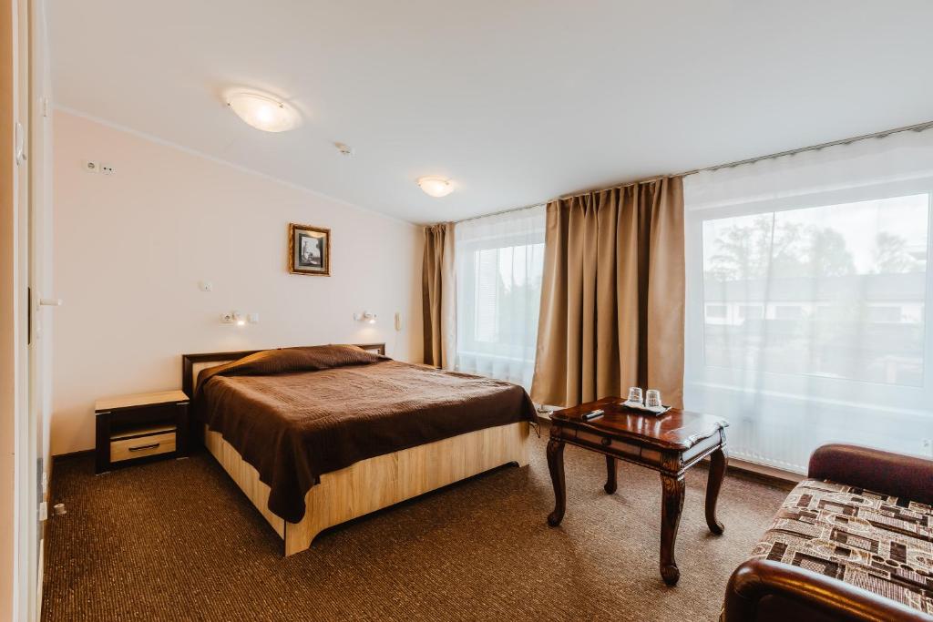 Postel nebo postele na pokoji v ubytování Aleksandri Hotel