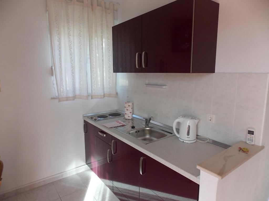 Kuchyňa alebo kuchynka v ubytovaní Apartmenthouse Trogir (4236)