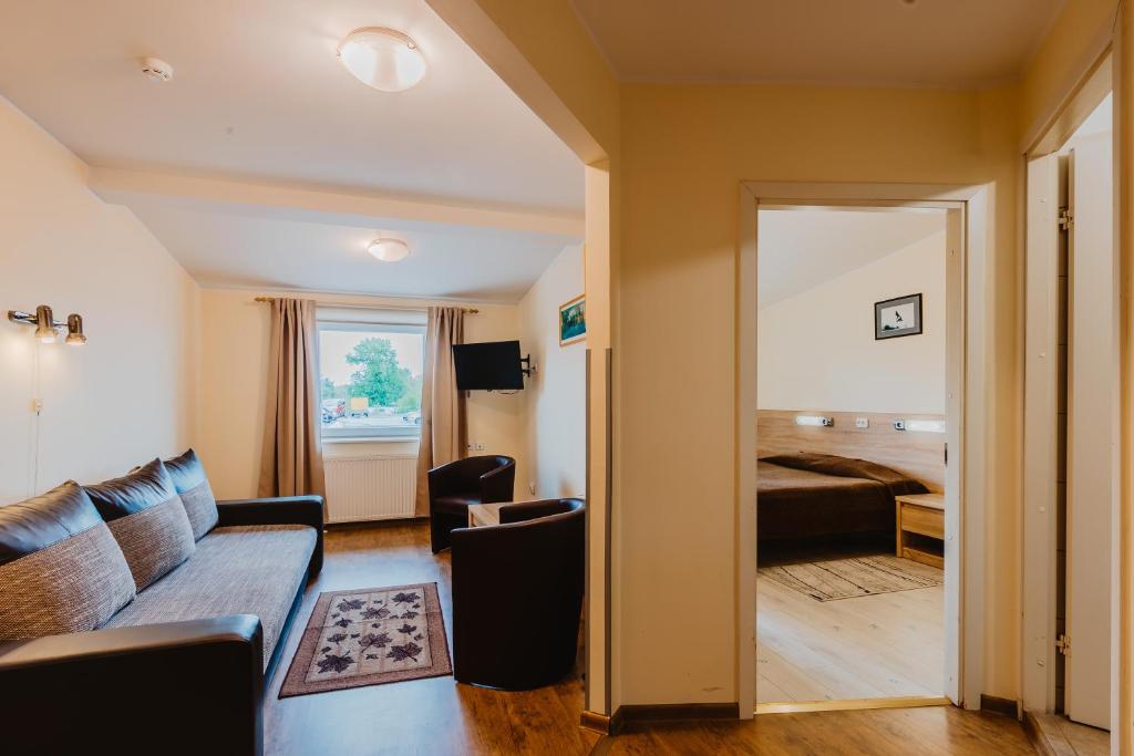 Postel nebo postele na pokoji v ubytování Aleksandri Hotel