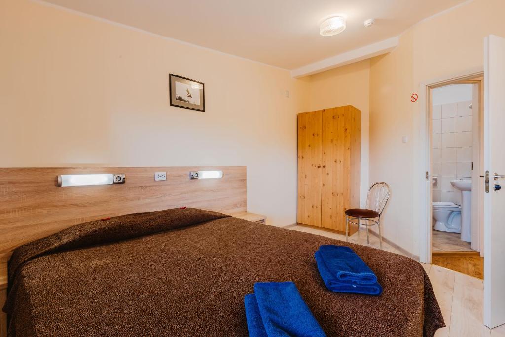 Postel nebo postele na pokoji v ubytování Aleksandri Hotel