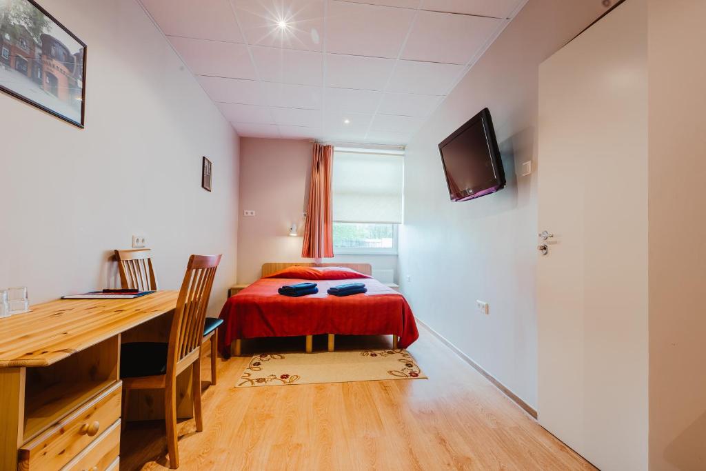 Postel nebo postele na pokoji v ubytování Aleksandri Hotel