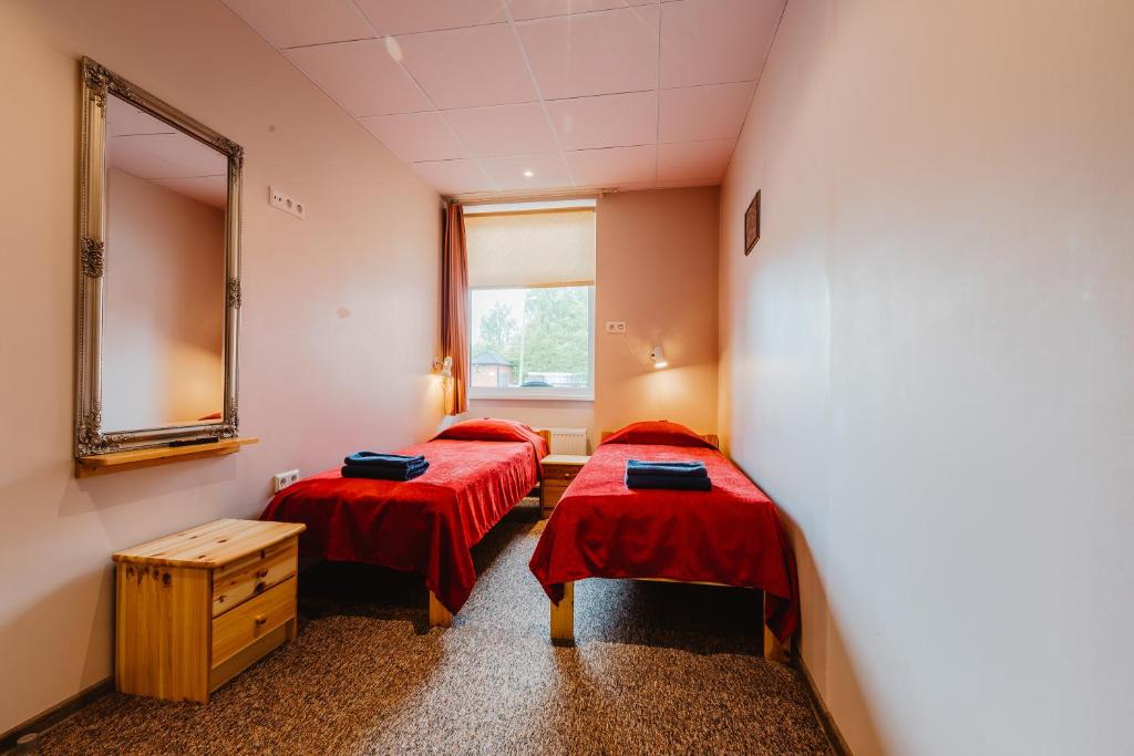 Postel nebo postele na pokoji v ubytování Aleksandri Hotel