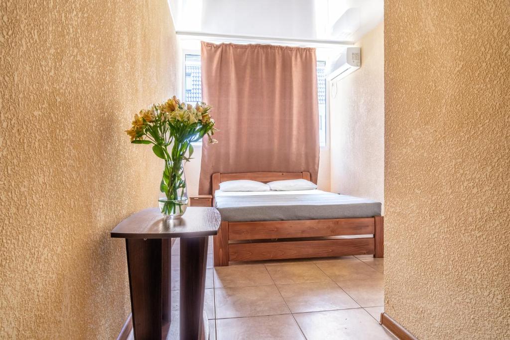 Postel nebo postele na pokoji v ubytování Santorini Beach Hotel Koblevo
