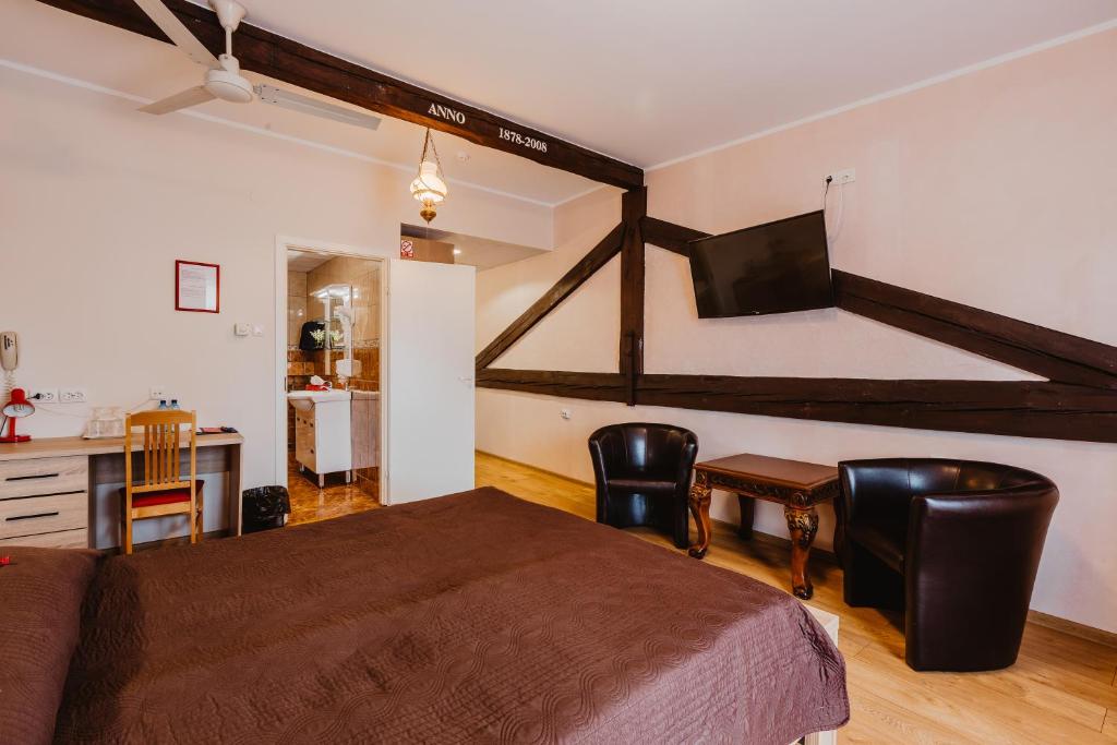 Postel nebo postele na pokoji v ubytování Aleksandri Hotel