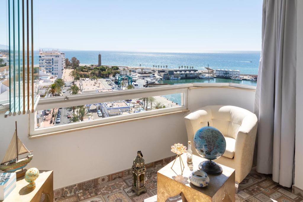 a living room with a view of the ocean at Apartamento Puerto Deportivo in Estepona