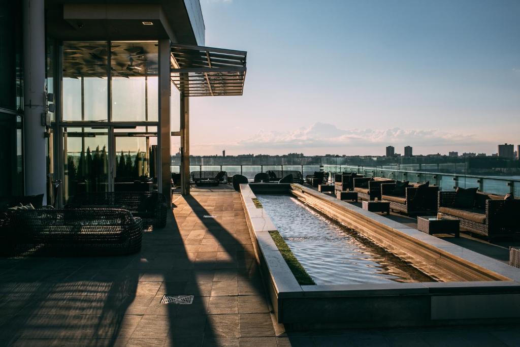 a building with a view of a body of water at Ink 48 Hotel in New York