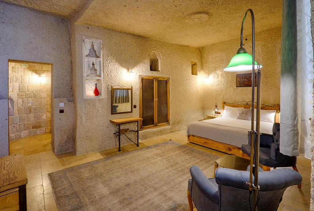 Postel nebo postele na pokoji v ubytování Design Cave Hotel