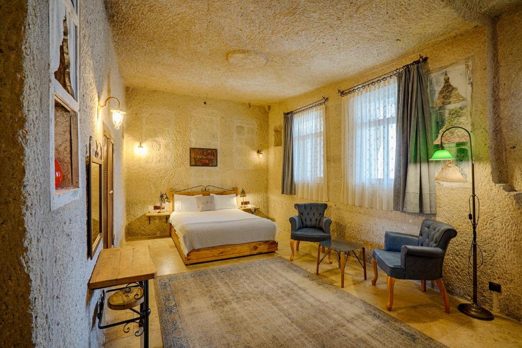 Postel nebo postele na pokoji v ubytování Design Cave Hotel