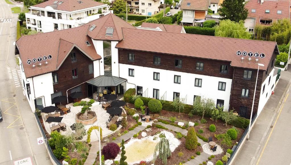 an aerial view of a building with a garden at Hôtel Les Muses in Annecy