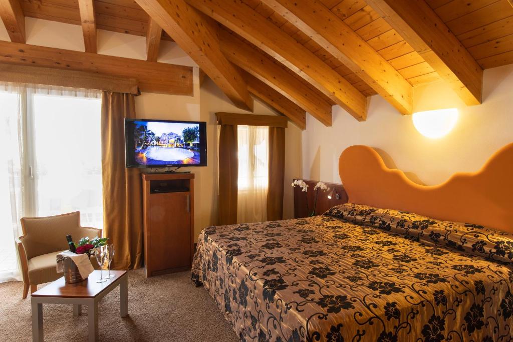 Łóżko lub łóżka w pokoju w obiekcie Color Hotel Style, Design & Gourmet