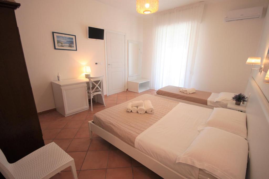 Postel nebo postele na pokoji v ubytování Solaris Guesthouse