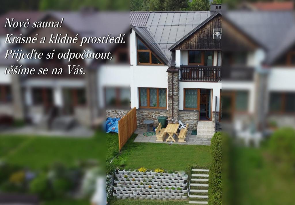 a model of a house with the words never summit refuse at Apartmány Kubova Huť in Kubova Huť