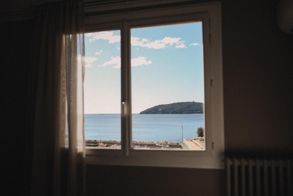 a window with a view of the ocean at Best Western Plus La Corniche in Toulon