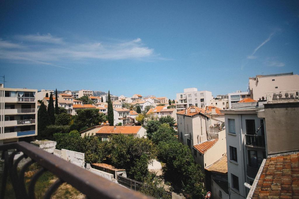 a view of a city from a balcony at Best Western Plus La Corniche in Toulon